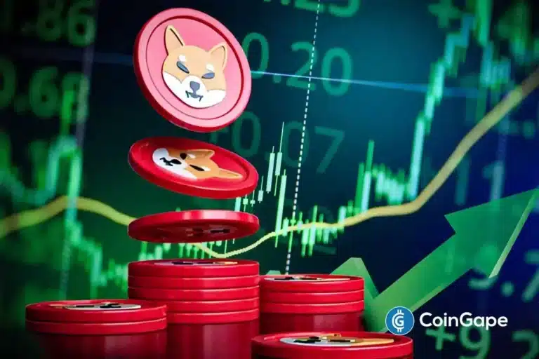 Moedas vermelhas com o logo do Shiba Inu empilhadas em frente a um gráfico de tendência de alta com seta verde.